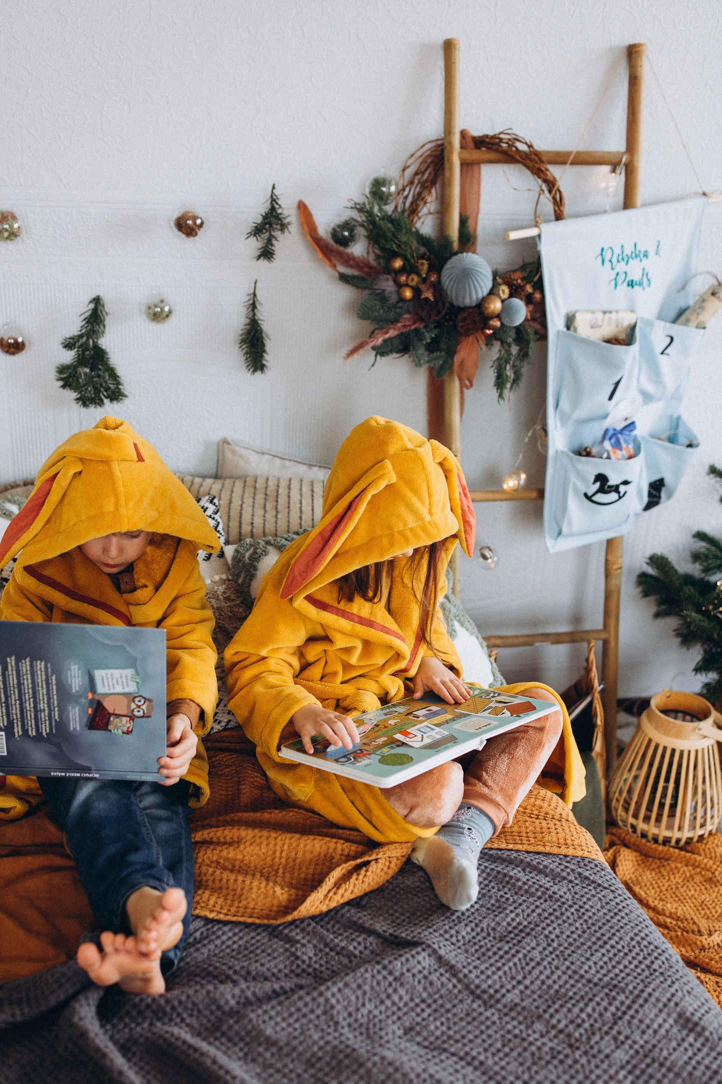 kids reading books in bed wearing bamboo bathrobes in yellow colour and cute bunny ears